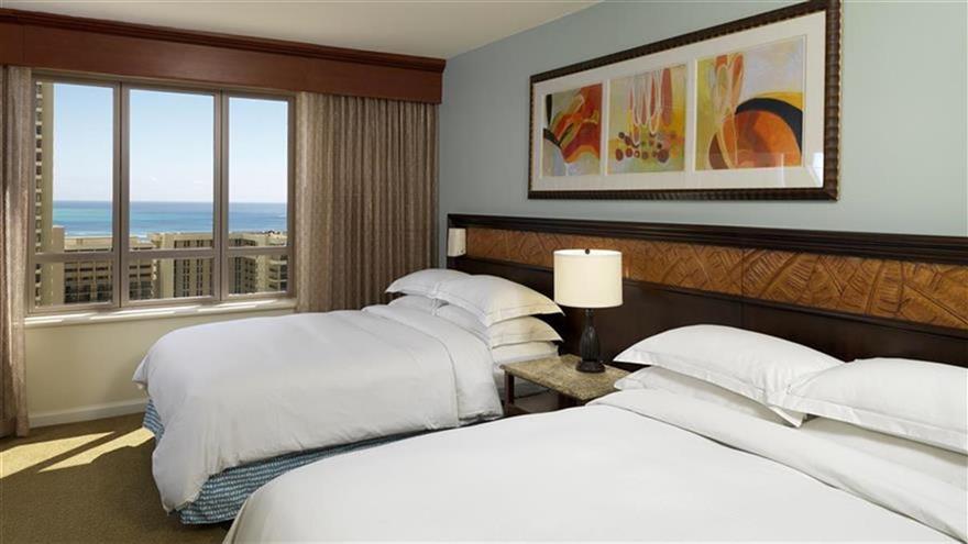 Bedroom with two beds at Grand Waikikian, a Hilton Grand Vacations Club located at Waikiki Beach, Oahu, Hawaii.
