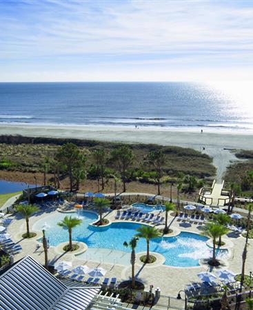 View from balcony of pool and ocean at Ocean Oak Resort, a Hilton Grand Vacations Club