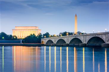 View Washington Monument and Museum, above their reflections in a lake.