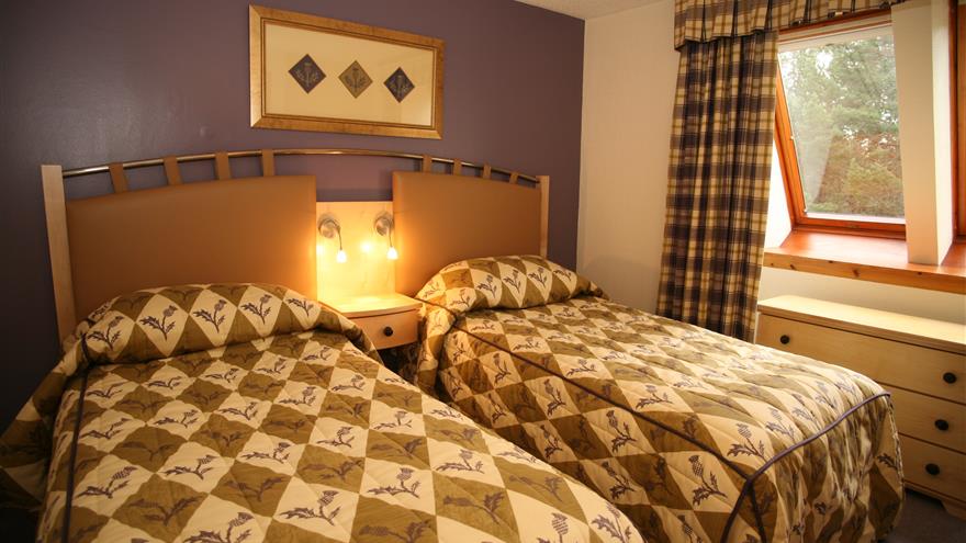 Bedroom with double bed at Coylumbridge, a Hilton Grand Vacations Club located at Aviemore, Scotland, U.K.