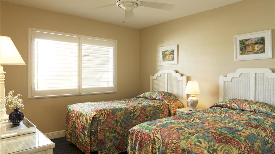 Two beds in a bedroom at Shell Island Beach Club Resort located on Sanibel Island, Florida.