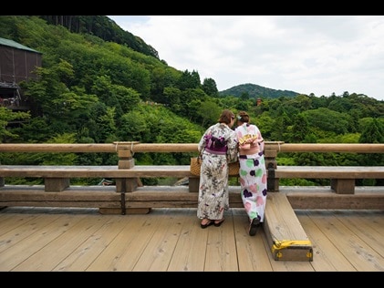 Women enjoying mountain view in Kyoto, Japan. 