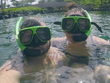 Couple snorkeling in Hawaii