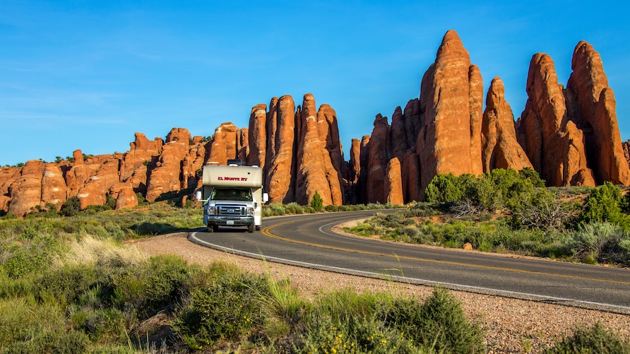 El Monte RV driving through Red Rocks, Utah. 