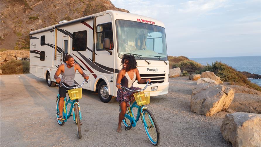 Couple of color riding bikes next to El Monte RV by the beach.