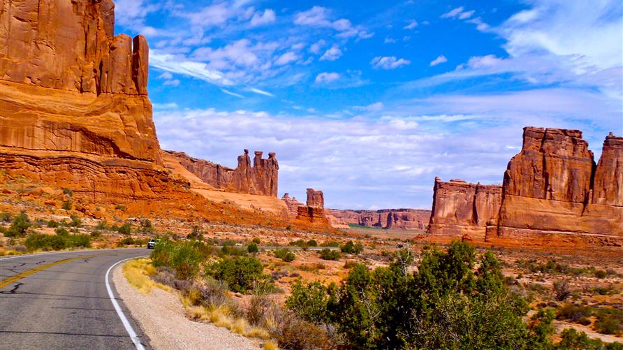 A picture of the open road in Arches National Park, Utah on a Utah National Parks road trip. 
