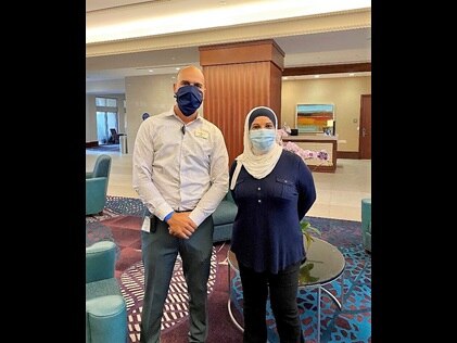 Hilton Grand Vacations Loss Prevention Director Ivan Melians and HGV Owner Mrs. Barakat. 