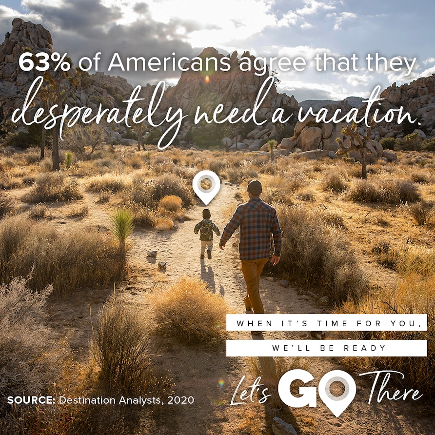 National Plan for Vacation Day promotional image of a father and son hiking through the desert. 