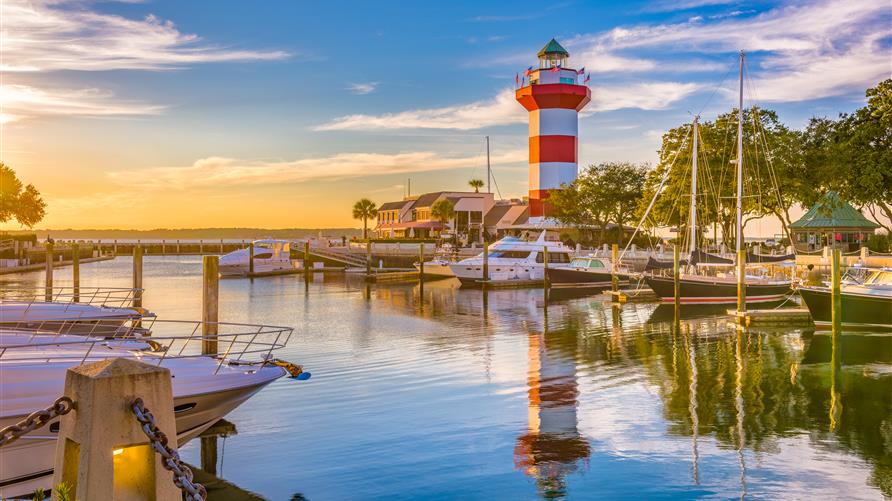Sunrise over the lighthouse and marina in Hilton Head, South Carolina. 