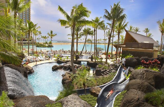 Pool with a waterslide at Grand Waikikian by Hilton Grand Vacations in Oahu. 