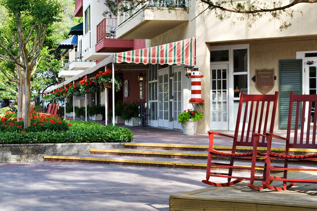 Picturesque sold southern storefront lined street with two red rocking chairs in Hilton Head, South Carolina. 