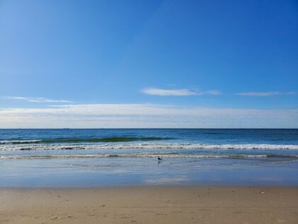 The sand meeting the sea at Rockaway Beach Queens, New York City.