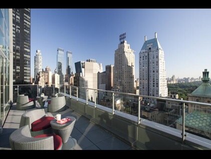 Private terrace with sprawling city views at West 57th Street by Hilton Club in New York City. 