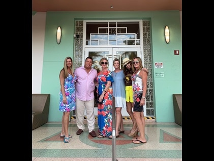 Hilton Grand Vacations Owner and wife posing with friends outside of Hilton Grand Vacations at McAlpin - Ocean Plaza.
