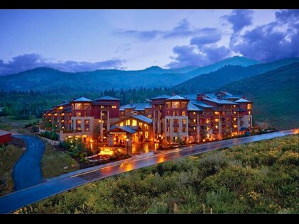 Sunrise Lodge, a Hilton Grand Vacations Club in Park City, Utah a glow on a summer night. 