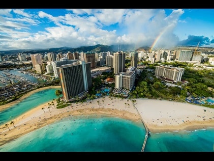 Aerial view of rainbow over Hilton Hawaiian Village on Oahu in Hawaii. 