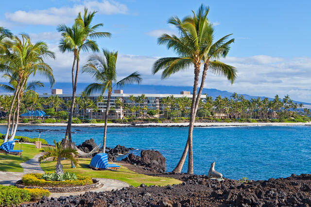 Palm trees, cabanas and hammocks at Hilton Hawaiian Village on Oahu in Hawaii. 