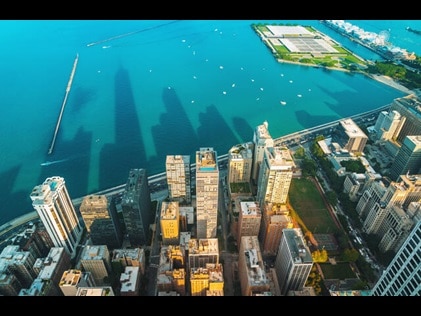 Stunning aerial view of the Chicago skyline where it meets the Lake Michigan shoreline. 