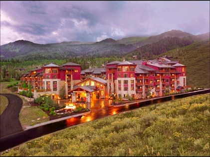 Aerial shot of Sunrise Lodge, a Hilton Grand Vacations Club nestled in mountains in Park City, Utah. 