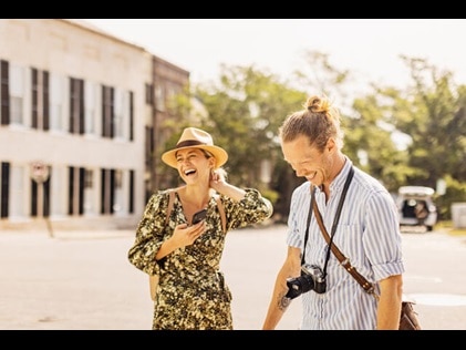 Couple laughing together while sightseeing in Charleston, South Carolina. 