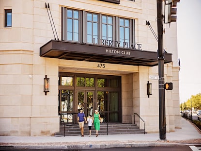 Family of three leaving Liberty Place Charleston by Hilton Club to explore Charleston, South Carolina. 