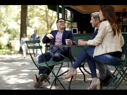 Friends enjoying coffee in Central Park in New York City. 