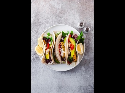 Overhead shot of plated tacos.