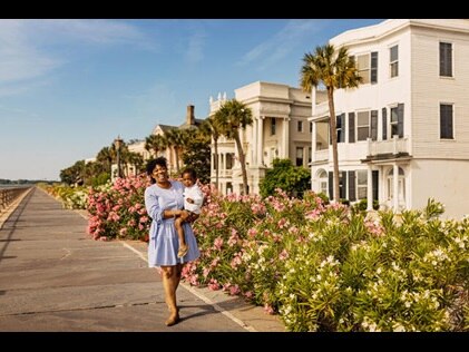Mom and young son walking happily walking along the Battery in Charleston, South Carolina. 