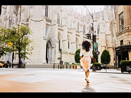 Woman running excitedly in New York City. 