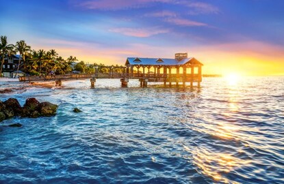 Beautiful tropical scene of a pier at sunset in the Florida Keys. 
