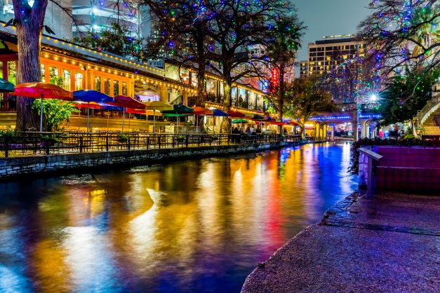 The River Walk in San Antonio lighting up the night sky with holiday lights.