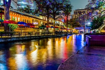 The River Walk in San Antonio lighting up the night sky with holiday lights. 