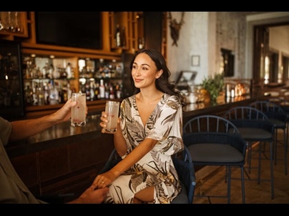Attractive woman enjoying at cocktail at a bar. 