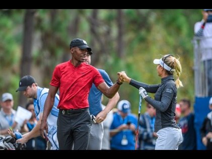 LPGA athlete and a celebrity fist bumping on the course at the Hilton Grand Vacations Tournament of Champions, Orlando, Florida. 