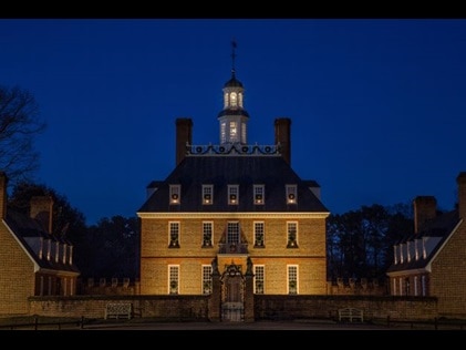 The Goveners Palace lit up eerily at night, Williamsburg, Virginia. 