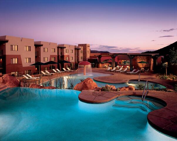 Pool view with violet sunset desert skies overhead, Hilton Sedona Resort at Bell Rock, Airzona. 