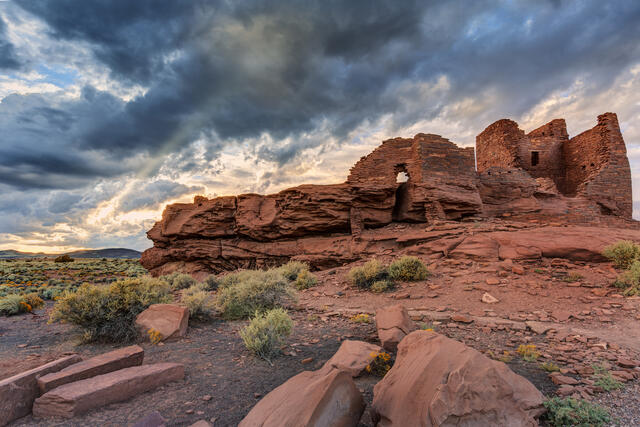 Ancient red rocks with gloomy clouds overhead, Sedona, Arizona.
