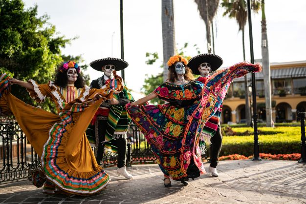 Dancers in sugar skull costumes, Los Cabos, Mexico.