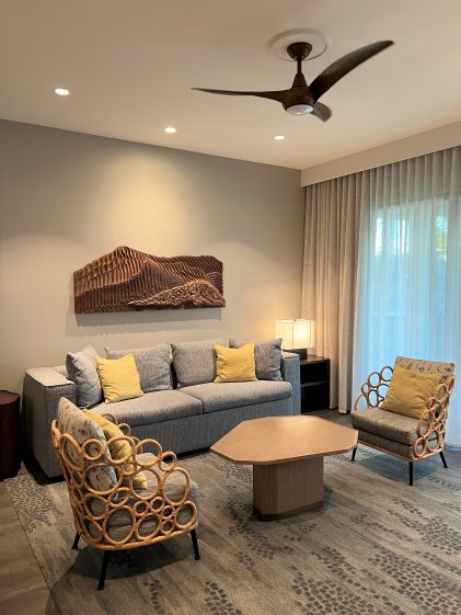 A sofa and chairs in the living room of the 2-Bedroom Suite at Maui Bay Villas, a Hilton Grand Vacations