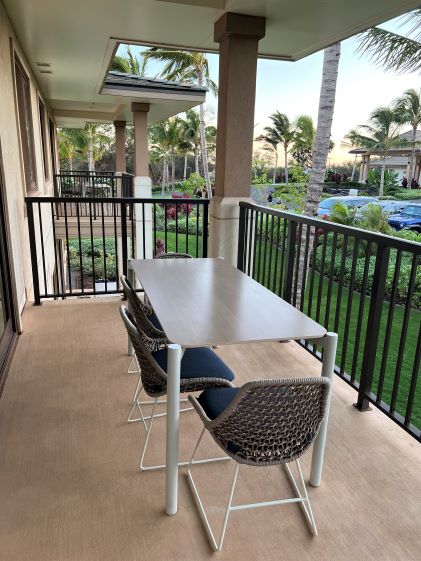 Four chairs and a table on a balcony in the 2-Bedroom Suite at Maui Bay Villas, a Hilton Grand Vacations