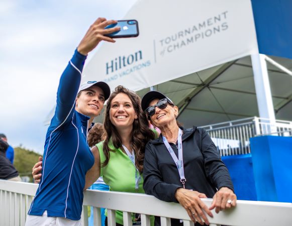 LPGA player Gaby Lopez takes a selfie with two Owners at the 2022 Hilton Grand Vacations Tournament of Champions in Orlando, Florida
