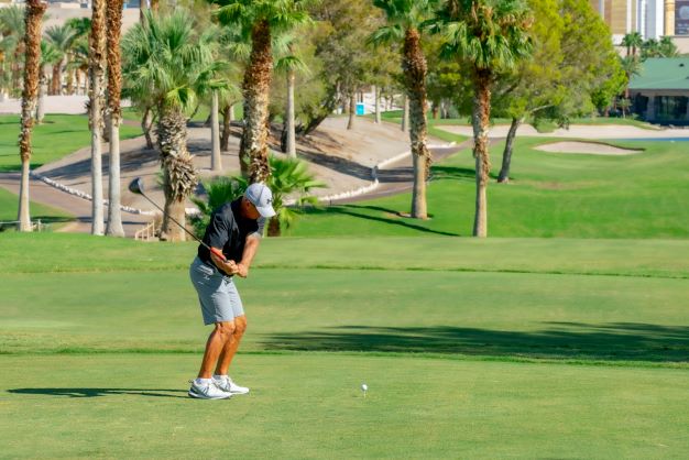 A golfer swings at the Viva! Las Vegas Pro-Am