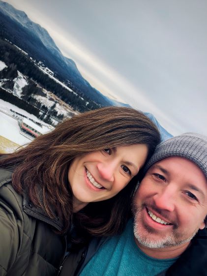 Gina, a Hilton Grand Vacations Owner, and her husband take a selfie while on vacation in Lake Placid, New York