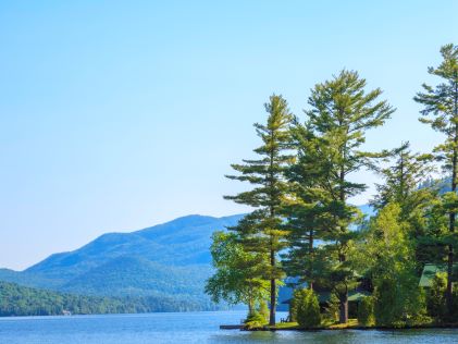 A lake and forested shore at Lake Placid, New York