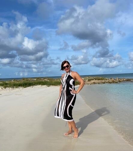 Hilton Grand Vacations Owner posing on beach, Aruba. 