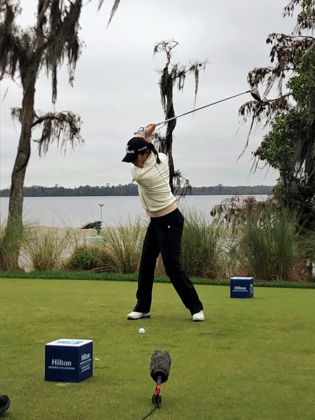 LPGA athlete taking a swing on the course at Hilton Grand Vacations Tournament of Champions, Orlando. 