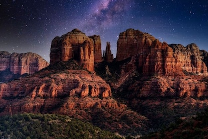 Breathaking image of the Milky Way glowing in the night sky above Cathedral Rock, Airport Mesa, Sedona, Arizona. 