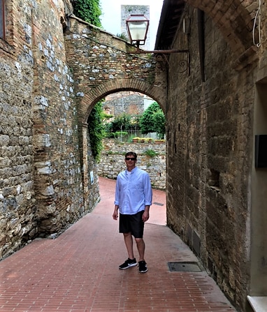 Hilton Grand Vacations Owner posing on vacation in Tuscany, Italy. 