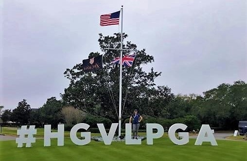 Hilton Grand Vacations Owner posing with giant #HGVLPGA sign at Lake Nona Golf & Country Club, Orlando.