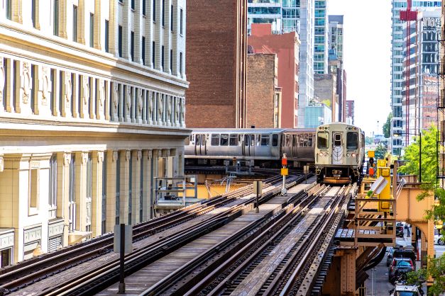 Stunning image of train turning corner in downtown Chicago.